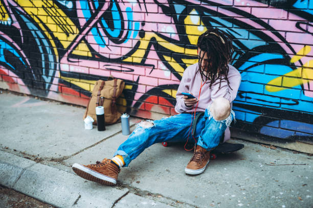 istock Graffiti artist listens to music 1276438003
