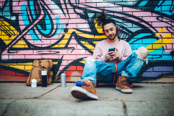 istock Graffiti artist listens to music 1276438247