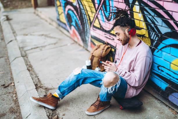 istock Graffiti artist listens to music 1276438332