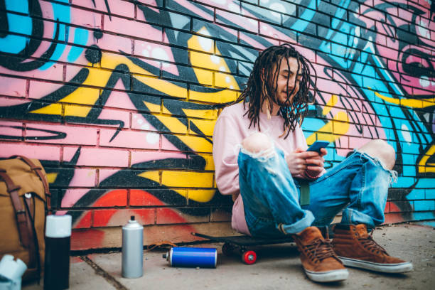 istock Graffiti artist checking social media 1276438408
