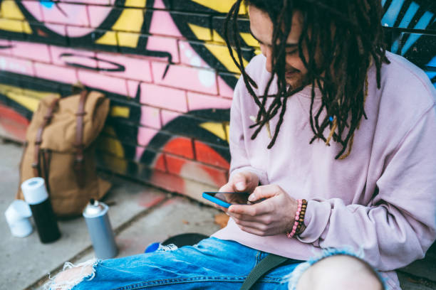 istock Graffiti artist checking social media 1276438502