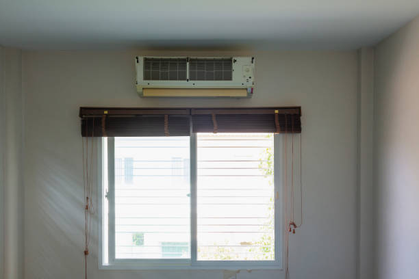 istock air conditional was remove plastic cover until cooling coil waiting repair or clean over window with sunlight 1276438796