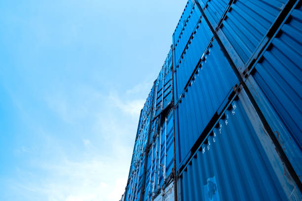 istock Logistic and transportation container cargo ship in the container yard shipping area. Industrial for logistic import and export business. Harbor freight blue tone. stacking of containers. 1276438951