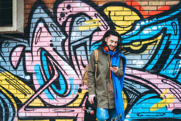 istock Young man with dreadlocks enjoys music 1276439332