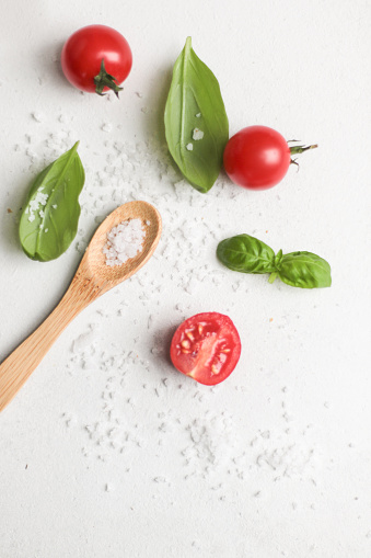 Italian Cooking style with salt, basil and cherry tomatoes