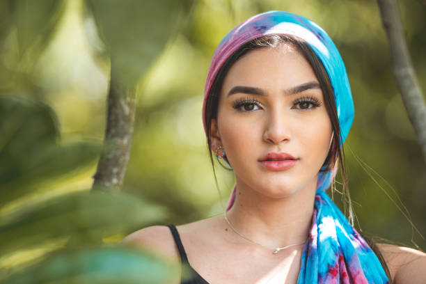 istock Young woman using bandana in nature 1276442652