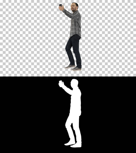 istock Happy smiling walking handsome bearded young man making selfie 1276442819