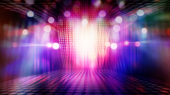 blurred empty theater stage with fun colourful spotlights, abstract image of concert lighting  illumination background