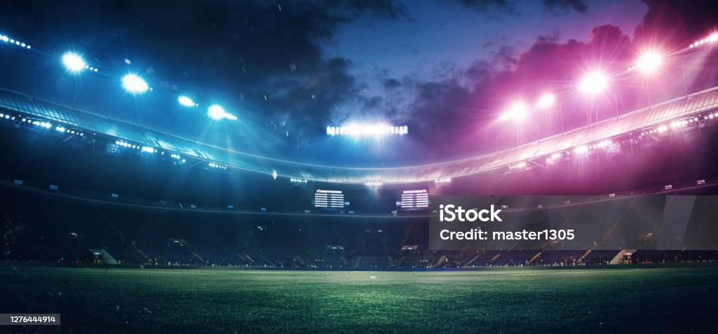 Full stadium and neoned colorful flashlights background Full stadium and neoned colorful flashlights background. Flyer with copyspace in modern colors. Concept of sport, competition, winning, action and motion. Empty area for championships, your ad, design. Stadium Stock Photo