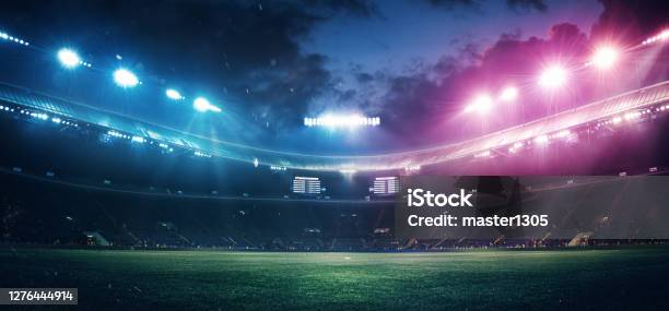 Full Stadium And Neoned Colorful Flashlights Background Stock Photo - Download Image Now