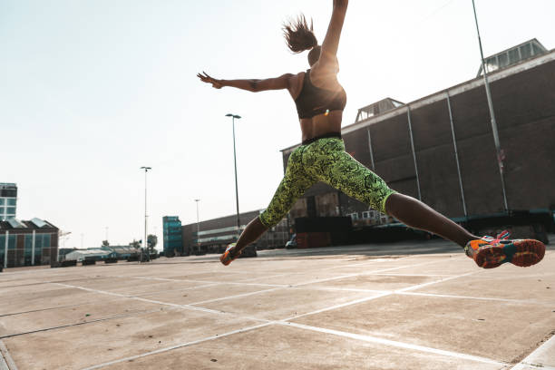 istock Woman getting fit in a urban setting 1276445032