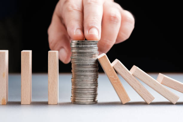 istock Money Stop the Falling Domino 1276446927