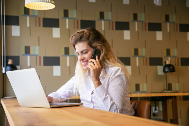 istock Positive female entrepreneur working at laptop 1276447720
