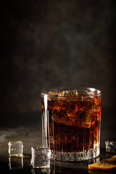 istock Glass of cola with ice 1276448087