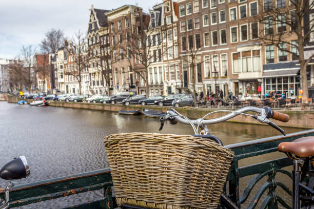 istock Amsterdam canal and bicycle on a bridge 1276448106