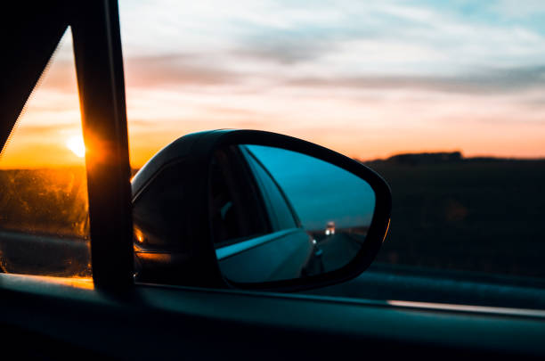istock Travelling by Car in Beautiful Sunset 1276448406