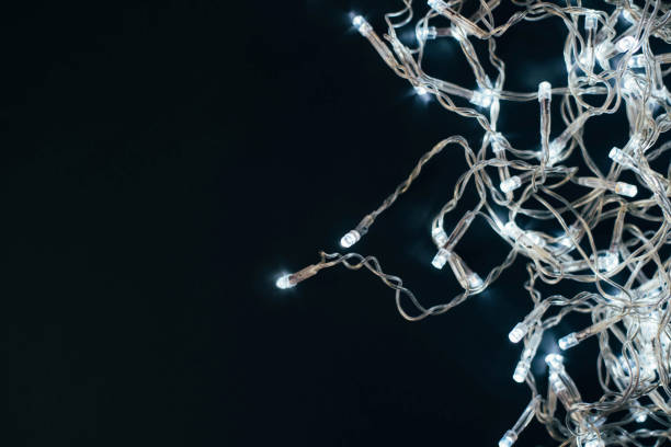 istock Christmas garland with lights on a black background. 1276448639