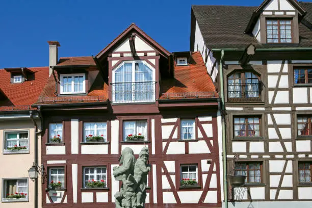 Schnabelgierebrunnen in front of half-timbered houses in Meersburg on Lake Constance, Baden-Wurttemberg, Germany, Europe