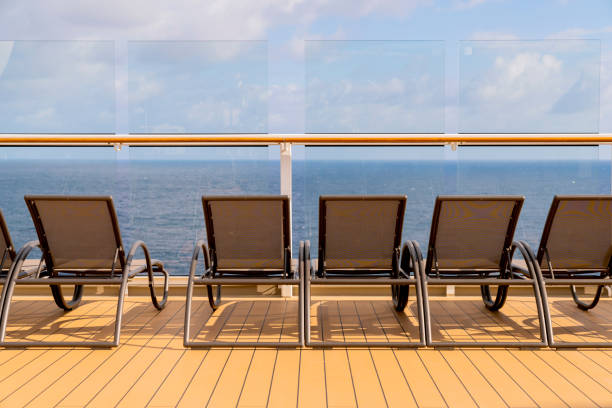 istock rows of empty sun bathing bench on board a cruise wooden deck sunset moment 1276451212