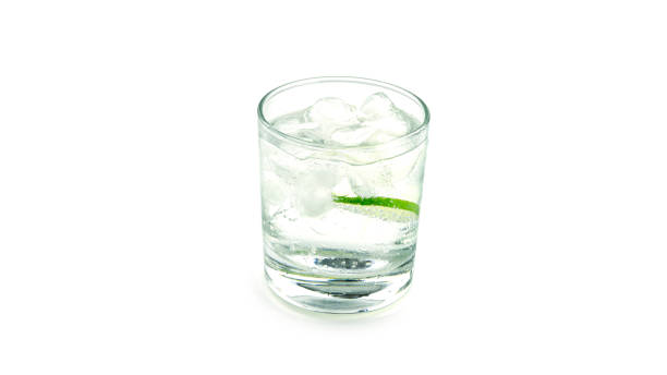 istock Transparent glass with lime lemonade on white background 1276451356