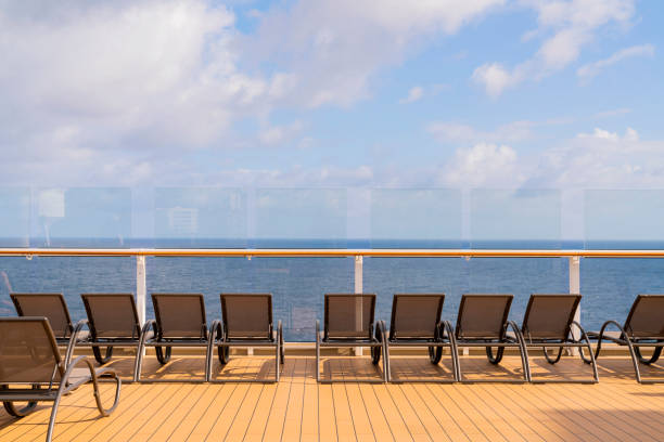 istock rows of empty sun bathing bench on board a cruise wooden deck sunset moment 1276451508