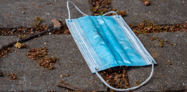 istock Used mouthguard thrown away on a street 1276452602