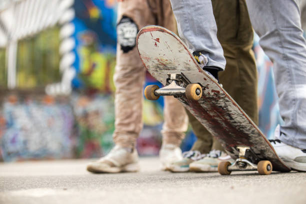 istock Closeup of a young man performing a trick with his skate 1276452863