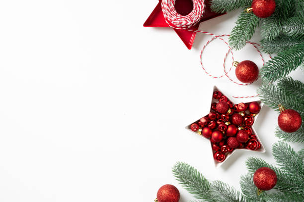 istock Christmas background. Red decorations on spruce branches on a white background. Christmas Flatly. Top view from copyspace 1276452994