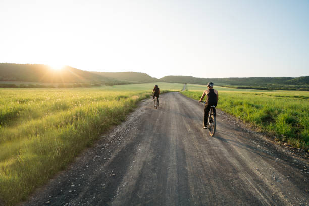istock Beautiful landscape in countryside and two cyclists 1276453437