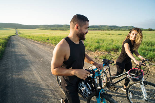istock Latin couple enjoying the countryside with bikes 1276453488