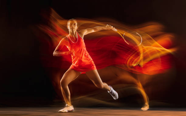 istock Professional female tennis player isolated on black studio background in mixed light 1276457273