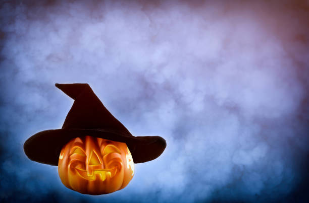 istock Halloween pumpkin with a black hat 1276458799