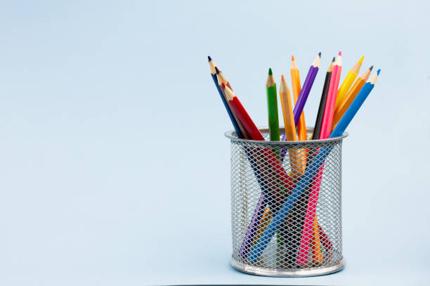 istock Many pencils in a stand on a blue background. 1276460868