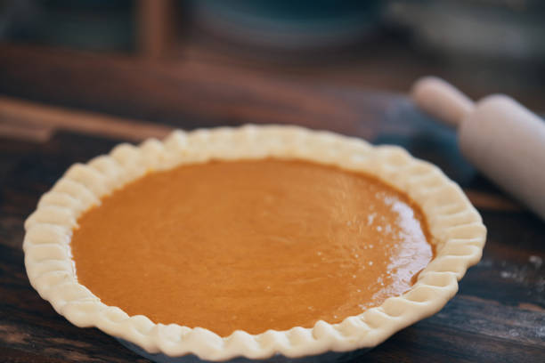 istock Preparing Pumpkin Pie for the Holidays in Domestic Kitchen 1276460915