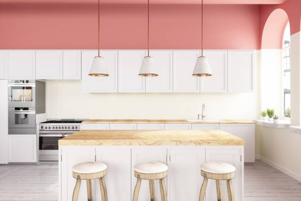 Pink Walled Kitchen With White Cabinets, Pendant Lights, Kitchen Island And Hardwood Floor Pink Walled Kitchen With White Cabinets, Pendant Lights, Kitchen Island And Hardwood Floor kitchen island stock pictures, royalty-free photos & images