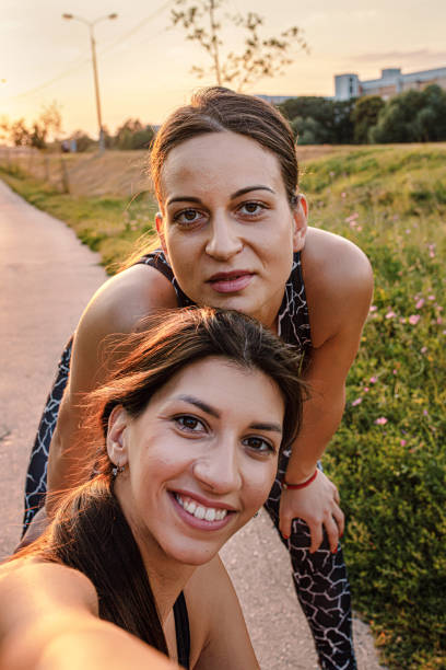 istock Two girls taking selfies after workout 1276462390