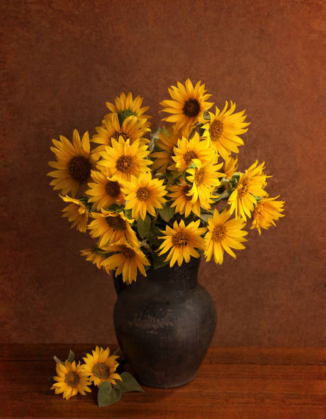 istock Still life with  Sunflowers in old clay pot. 1276462966
