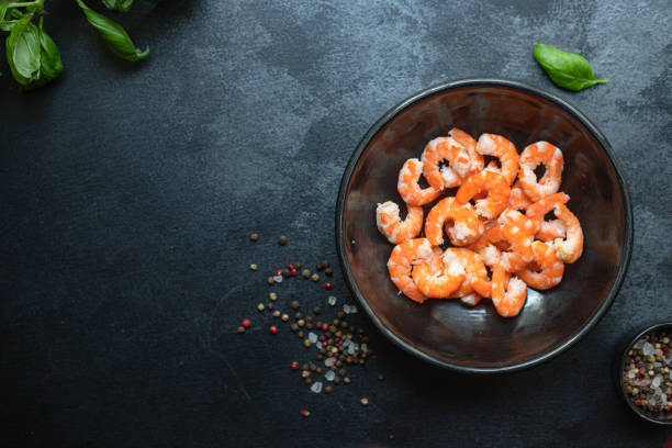 istock shrimp ready to eat prawn boiled or fried seafood without shell on the table top view  copy space for text diet pescetarian food background rustic 1276464235