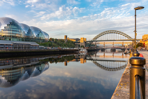 The bridges between Gateshead and Newcastle-upon-Tyne on the River Tyne lit by a stunning late summer sunrise.