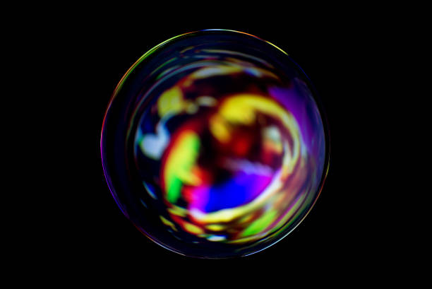 istock Blurry image of a shiny crystal ball with abstract blurry colorful pattern. Abstract lensball in blur. 1276465973