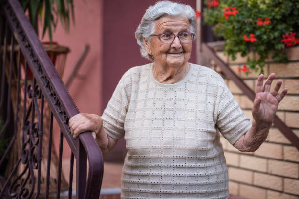 istock Happy senior woman waves her hand 1276468535