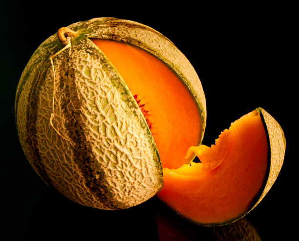 istock slice of watermelon on black background 1276468753