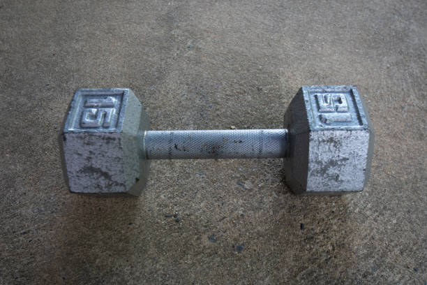 istock A Silver Fifteen Pound Dumbbell on Concrete 1276472898