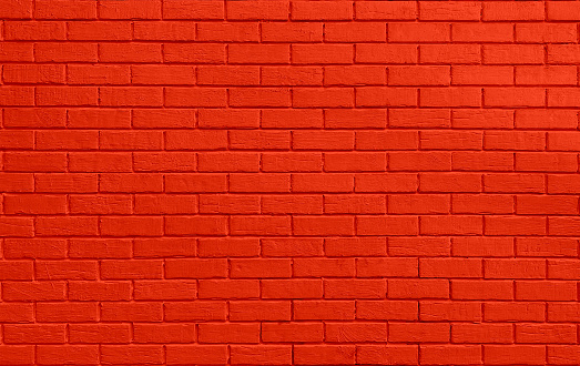 Red colored brick wall. Brickwall texture background