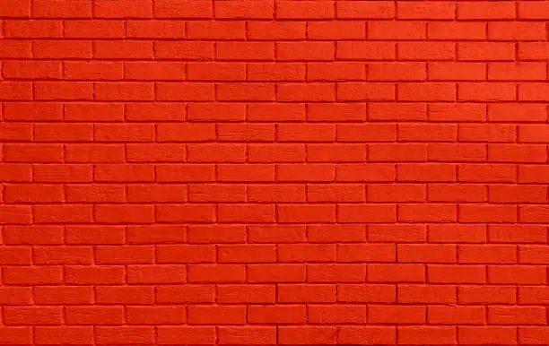 Red colored brick wall. Brickwall texture background