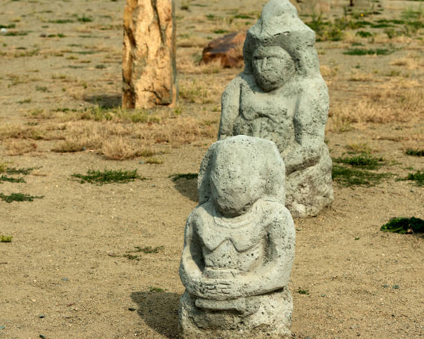 istock Stone statues in a clearing on a sunny day. 1276473921