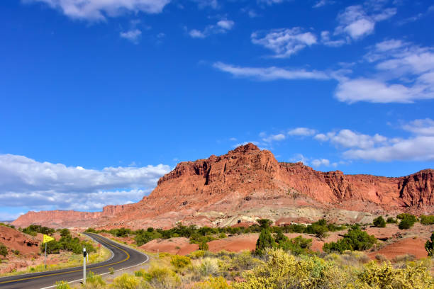 istock Lonely road through Capitol Reef National Park, Utah 1276476536