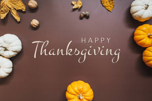istock Happy Thanksgiving Day with pumpkin and nut on the table 1276478717