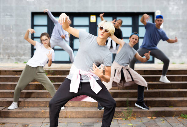 istock Confident teenager street dancer performing with group 1276479104