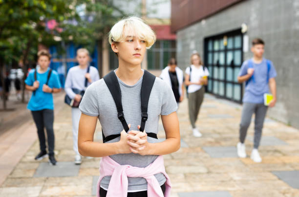 Handsome young man going to college down city street Handsome young man going to college down the city street 12 17 months stock pictures, royalty-free photos & images